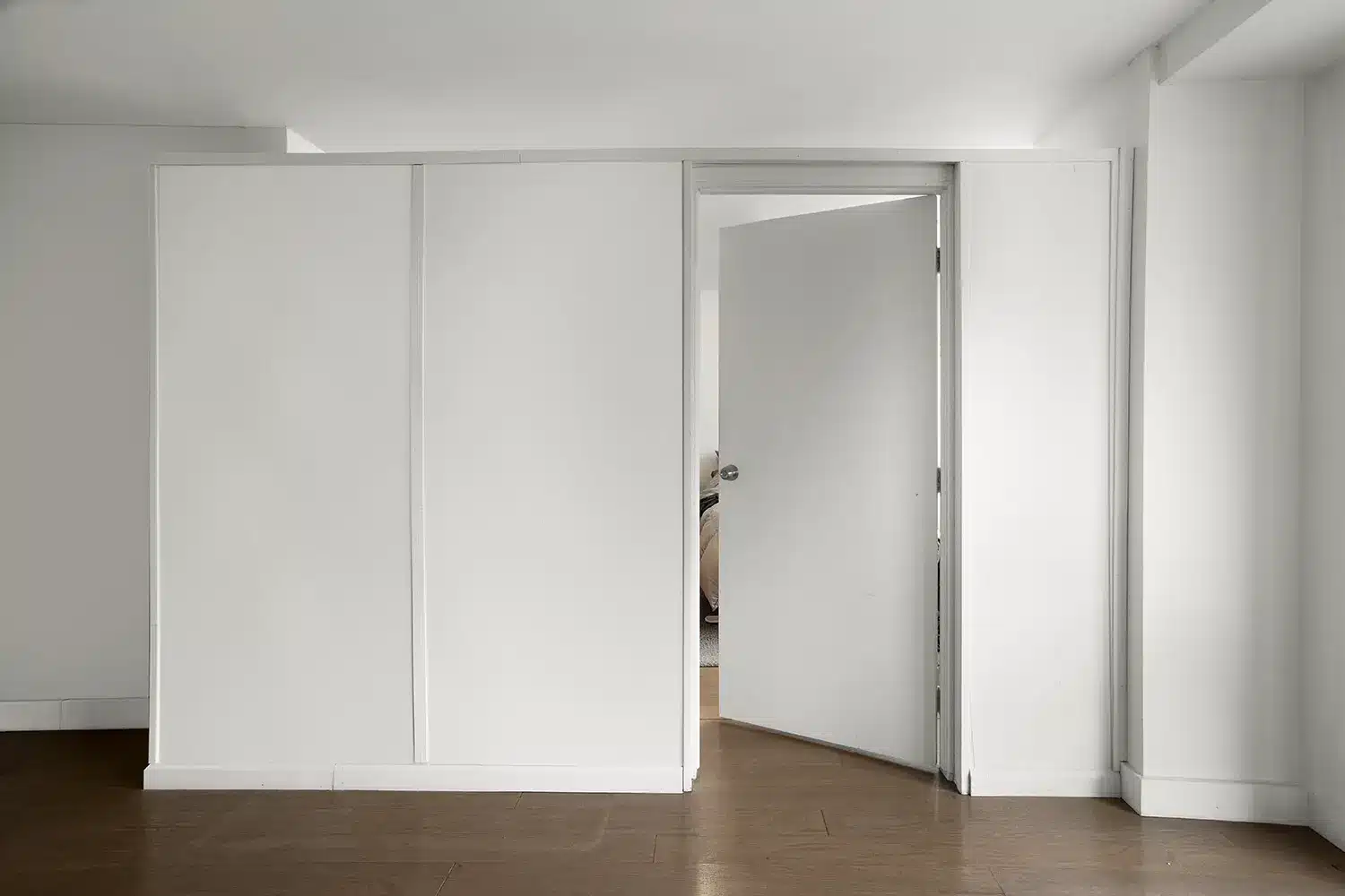 L shaped divider with swing door.